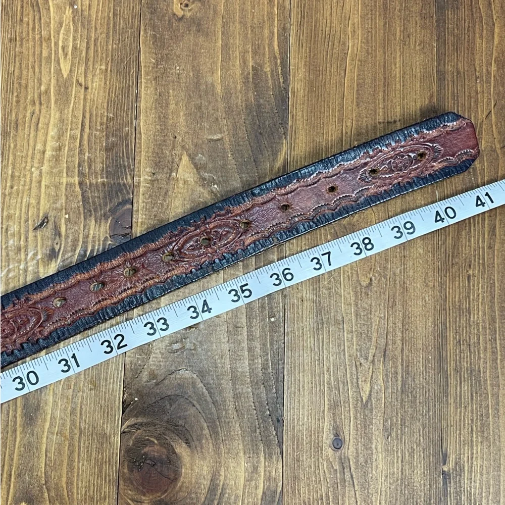 Brown leather belt with embossed design